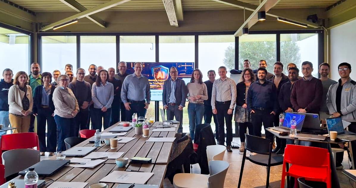People and partners posing in a conference room.